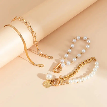 Chic 4-Piece Gold Bracelet Set – Snake Chain, Pearls & Links